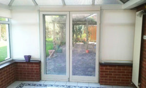 Two standard fly screen doors on conservatory doors