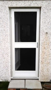 White standard fly screen door on a residential door