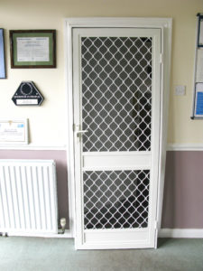 White fly screen security door on a office door