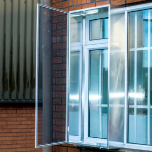 Hinged canopy box fly screen on an external window
