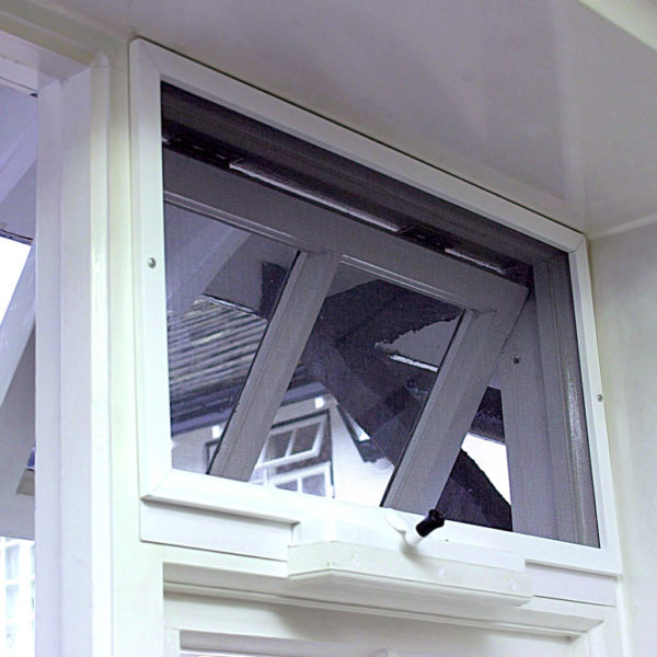 Interior view of a fly screened window with a chain winder
