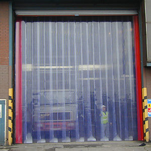 Tall PVC Strip Curtain covering a warehouse door and a vehicle