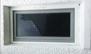 External image of a white fly screen window installed outside on a window